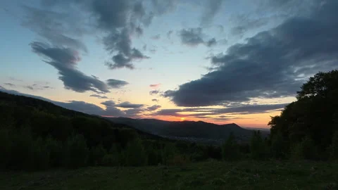 Amazing summer sunset in mountains with cloudy colorful sky Stock Footage 329574210