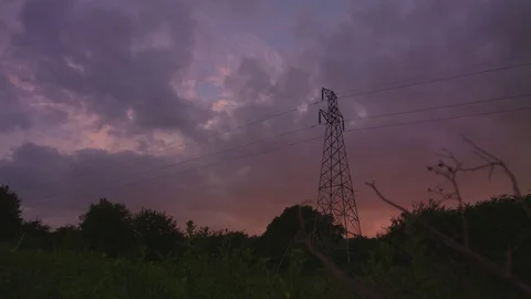 Amazing sun set time lapse with electric pylon Stock Footage 77192262