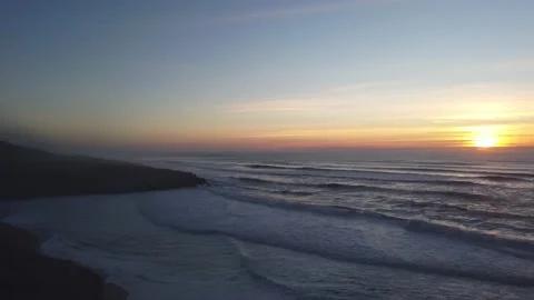 Amazing sunset in a beach with the ocean in background. Stock Footage 134836703