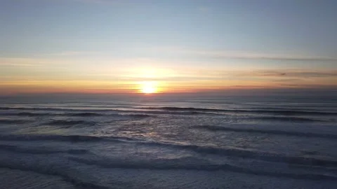 Amazing sunset in a beach with the ocean in background. Stock Footage 134836705