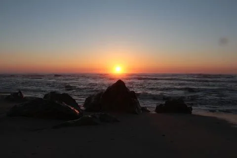 Amazing sunset at the beach Stock Photos