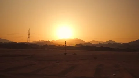 Amazing sunset in the desert with mountain range on horizon. Side view from the Stock Footage 251744564