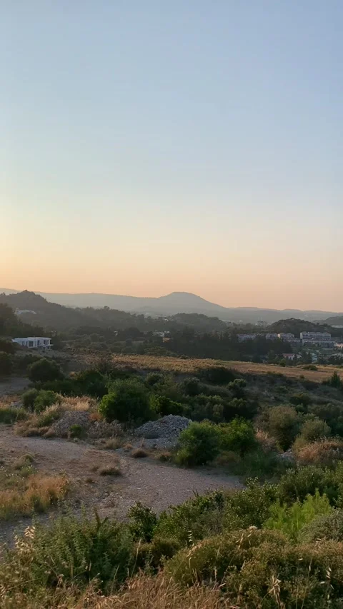 Amazing sunset in Greece. Viewpoint on the mountains, city and sea Stock Footage 315032091