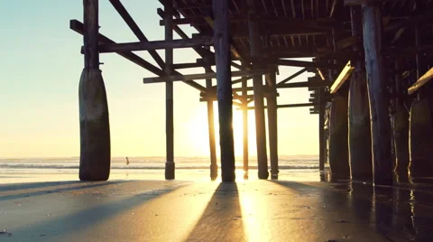 Amazing Sunset Light Flares Under Pier. Beach Sunset. Slow Motion Stock Footage 61245397