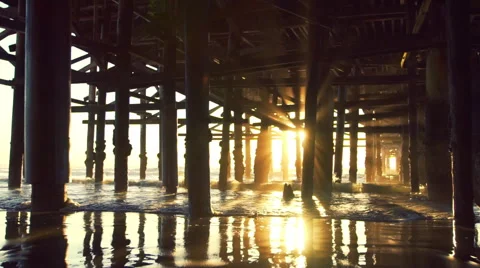 Amazing Sunset Light Flares Under Pier. Beach Sunset. Slow Motion Video stock 61246603