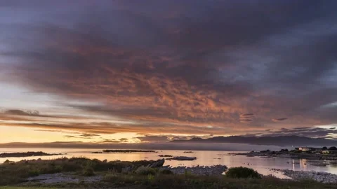 Amazing sunset with lovely cloud formations in Kaikura, New Zealand, 4k Stock Footage 231931445