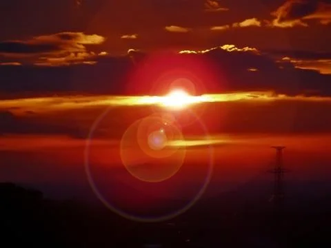 Amazing sunset orange sun in the clouds. 스톡 일러스트