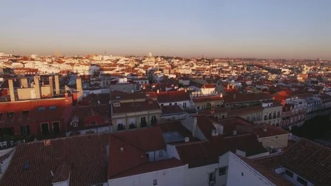 Amazing sunset over red tile roofs of big city Video stock 82565167