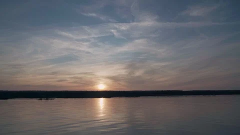 Amazing sunset over the river, view from the boat in motion Stock Footage 127144483