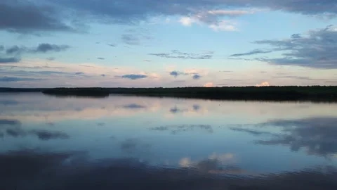 Amazing sunset on the river. Reflection of the sky in the water. 4k Stock-Footage 197073700