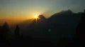 Amazing sunset, sun slowly hiding behind mountain time-lapse HD Footage