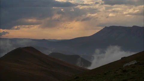 Amazing sunset with thick flowing clouds in the Caucasus mountains. Kabardino Video stock 143117539