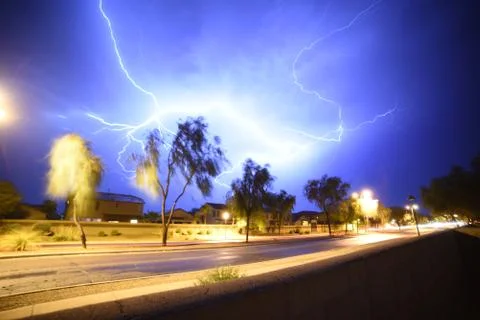 Amazing Thunders storm over a pool in the backyard of a house Stock Photos