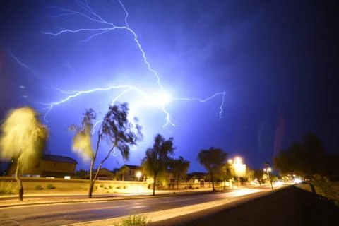Amazing Thunders storm over a pool in the backyard of a house Stock Photos