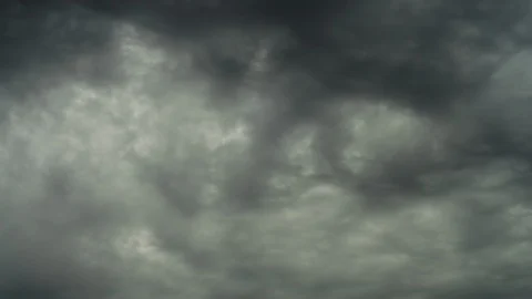 Amazing time-lapse of dramatic gray clouds, moving in diagonal of frame. Stock Footage 98094556