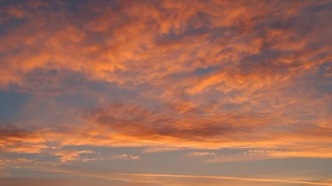 Amazing time-lapse of evening or morning sky with orange and yellow clouds. Stock Footage 98108770