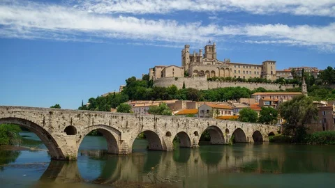 Amazing time-lapse video of old bridge and Saint Nazaire cathedral on the Orb Stock Footage 99886876