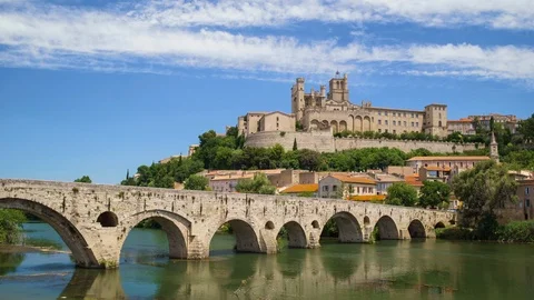 Amazing time-lapse video of old bridge and Saint Nazaire cathedral on the Orb Stock Footage 103560648