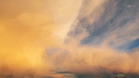 Amazing timelapse of bright sunset clouds moving over the sky. Stock Footage 129217227