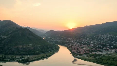 Amazing timelapse of sun setting over mountains behind the old Georgian town Stock Footage 112489249