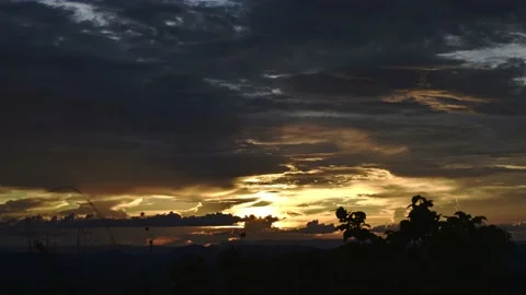 Amazing Timelapse of a sunset with clouds and moutains - sun light reflections Stock Footage 151335966