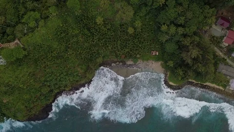 Amazing top view of breaking waves in green island Stock Footage 113046851