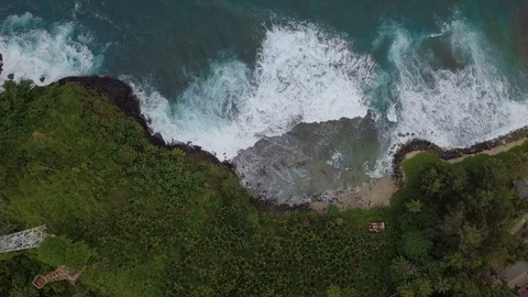 Amazing top view of breaking waves in green island Stock Footage 113049331