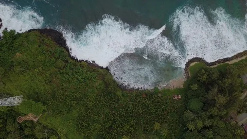 Amazing top view of breaking waves in green island Stock Footage 113049360