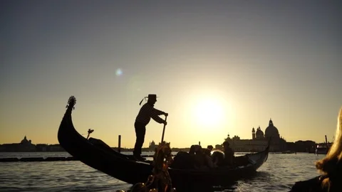 Amazing Venice destination - tourists and gondolier beautiful sunset golden hour Stock Footage