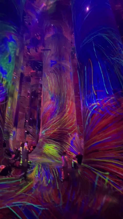 Amazing vertical panning shot inside the teamLab Phenomena with surreal Stock Footage 327339893