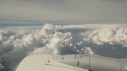 Amazing view from airplane window in flight, stunning big clouds and aerial Stock Footage 172009115