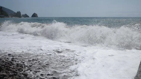 Amazing view of the big sea waves breaking foam on the pebbles on the shore. Stock Footage 337221026