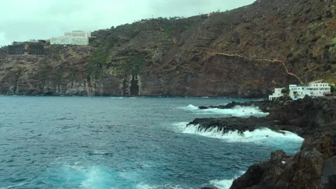 Amazing view of the cliffs and waves crushing on rocky shore.Costa de Acentejo Stock Footage 164855798