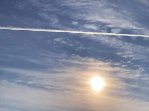 Amazing view of clouds and rocket smoke in a beautiful blue sky. Stock Photos