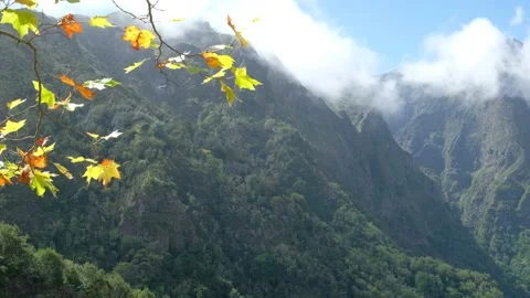 Amazing view of different mountain peaks during a sunny day with clouds passing Stock Footage 171558492