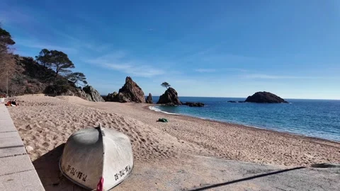 Amazing view to empty paradise beach with boat and rocks, 4K Stock Footage 265521461