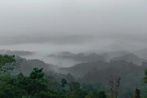 Amazing view of floating clouds over Sajek Valley hills Stock Photos