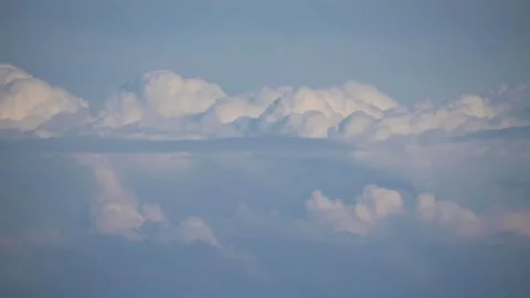 Amazing view of fluffy clouds moving and reflecting in water Stock Footage 277686327