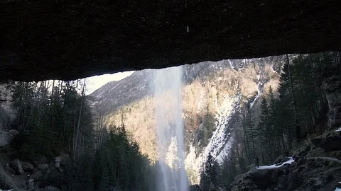 Amazing view form under a cliff with a waterfall Stock Footage 103218780