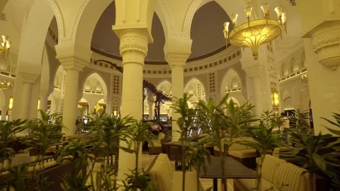 Amazing  view of a hall with many pillars and fancy lights in Dubai Mall Stock Footage 103809974