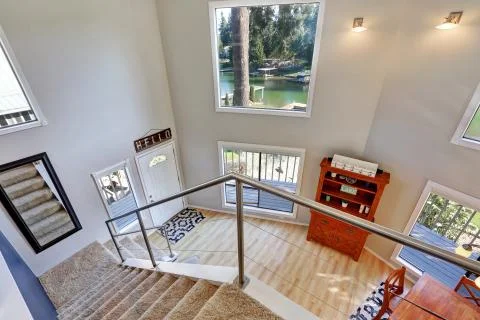 Amazing view looking down the foyer entry with hardwood floor Stock Photos