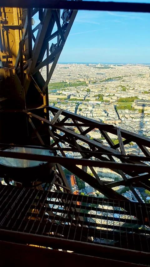 Amazing view of Paris city from ascending Eiffel tower lift. 4K vertical footage Stock Footage 282915455