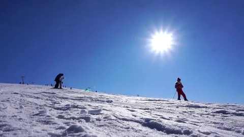 Amazing view of snow capped hill with skiers and snowboarders on bright day Stockbeeldmateriaal 81550053