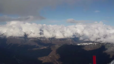 Amazing view from the top of the mountain to the clouds at the winter resort Stock Footage 232416796