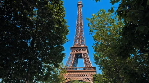 Amazing view of the Tour between green trees of the World famous symbol. Stock Footage 245456298