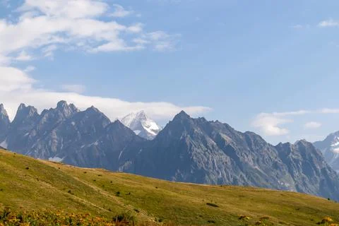 Amazing view from the Tskahazagari peak on the sharp Svaneti mountain peaks.. Stock Photos