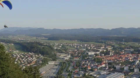 Amazing view of two brave pilots paragliding over Slovenj Gradec, Slovenia Stock Footage 138129102