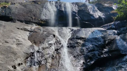 Amazing view of waterfall over the rocks under the blue sky Stock Footage 150684813