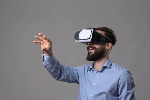Amazing virtual reality experience of young business man wearing vr glasses a Stock Photos
