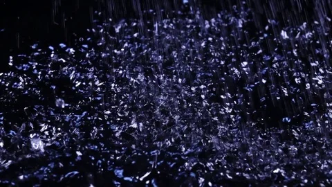 Amazing water shower and splashing on dark surface in slow motion Stock Footage 78355053